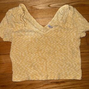 Woman’s yellow crop top